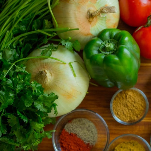 The backbone of chicken tortilla soup - onions, tomatoes, and bell peppers.