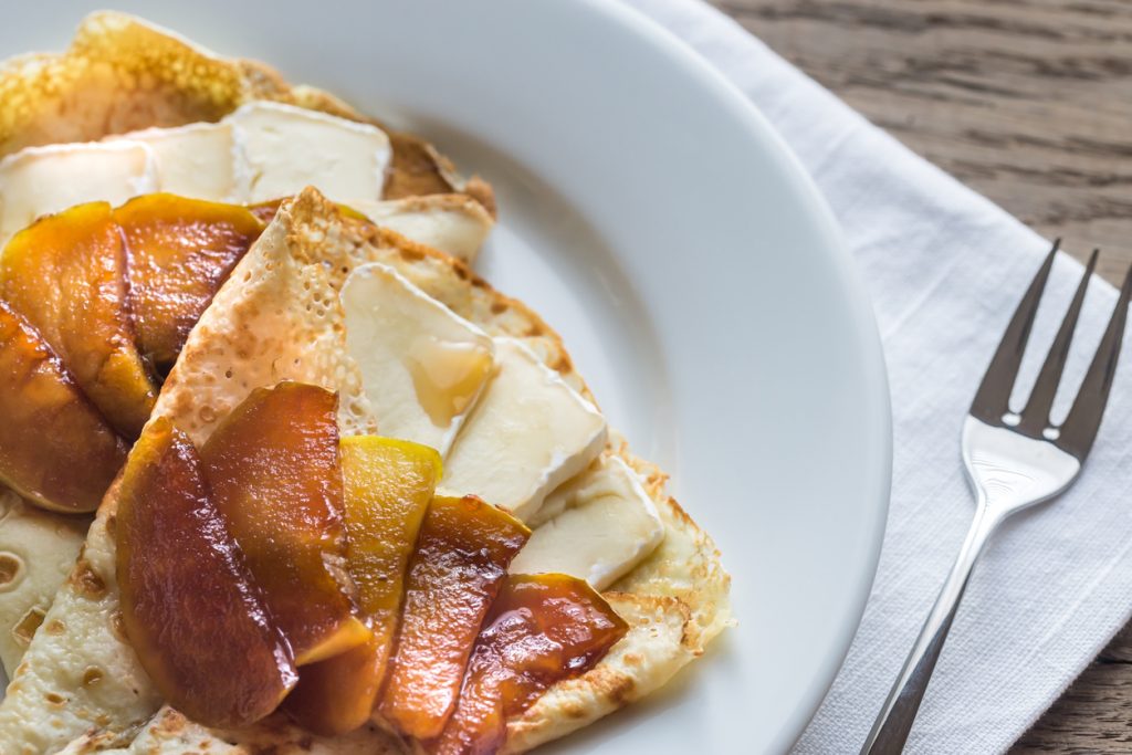 Crepes with brie and caramelized slices of apple